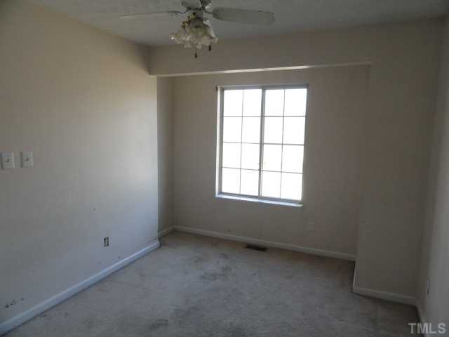 5101 Ranada Court Raleigh, NC 27616 - Photo 6 of 10 an empty room with a window