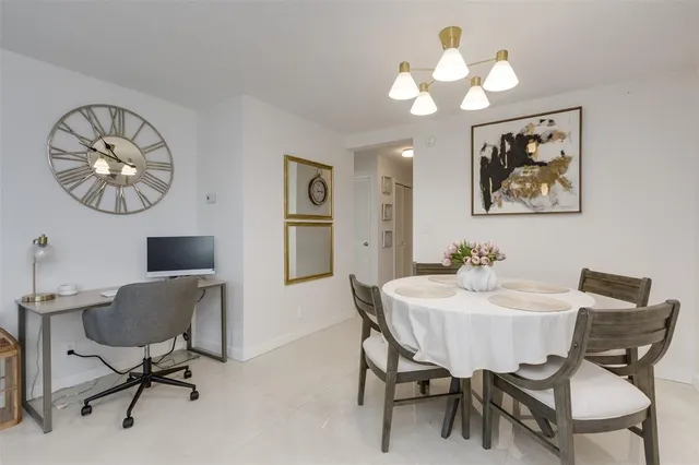 a kitchen with cabinets appliances and a sink