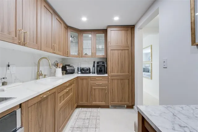 a view of a room with furniture and wooden floor