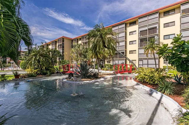 front view of a building with a garden