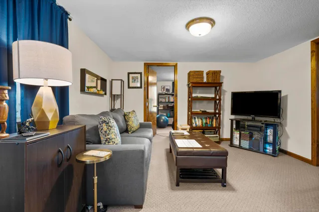 a bedroom with a bed and dresser