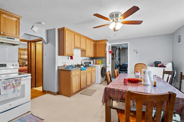 a dining room with furniture and window