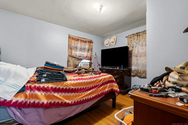 a bathroom with a sink a mirror a toilet and a shower