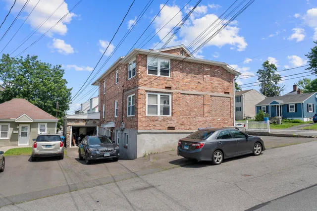 a car parked in front of a house