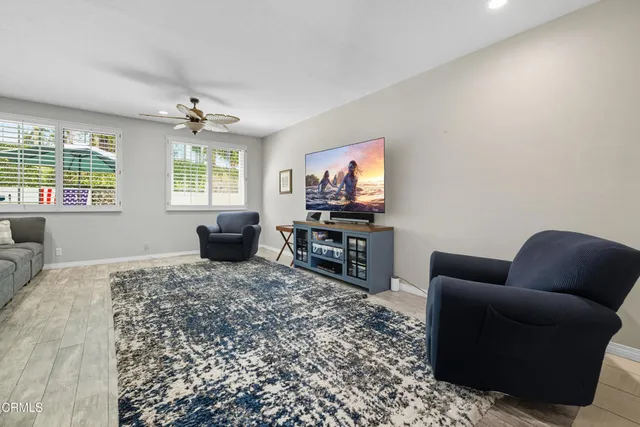 a living room with furniture and a window