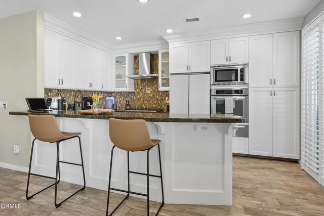 a kitchen with appliances and cabinets