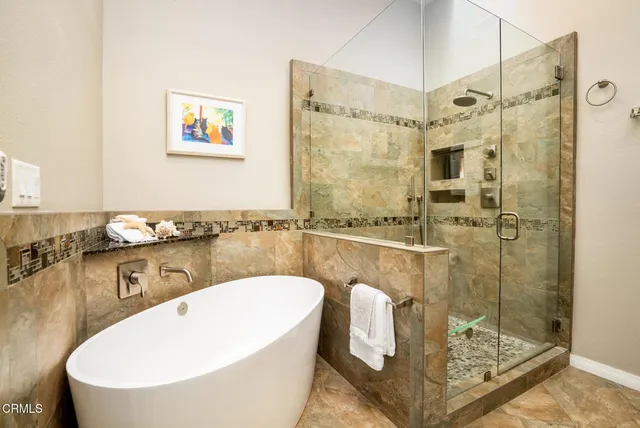 a view of a chairs and a table in the patio