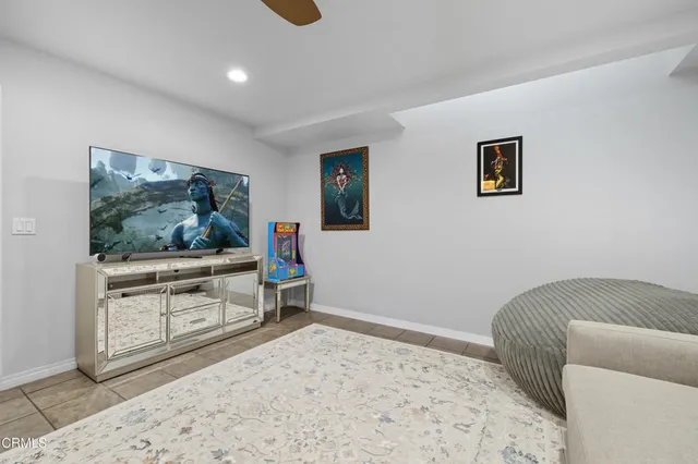 a view of a house with swimming pool and sitting area