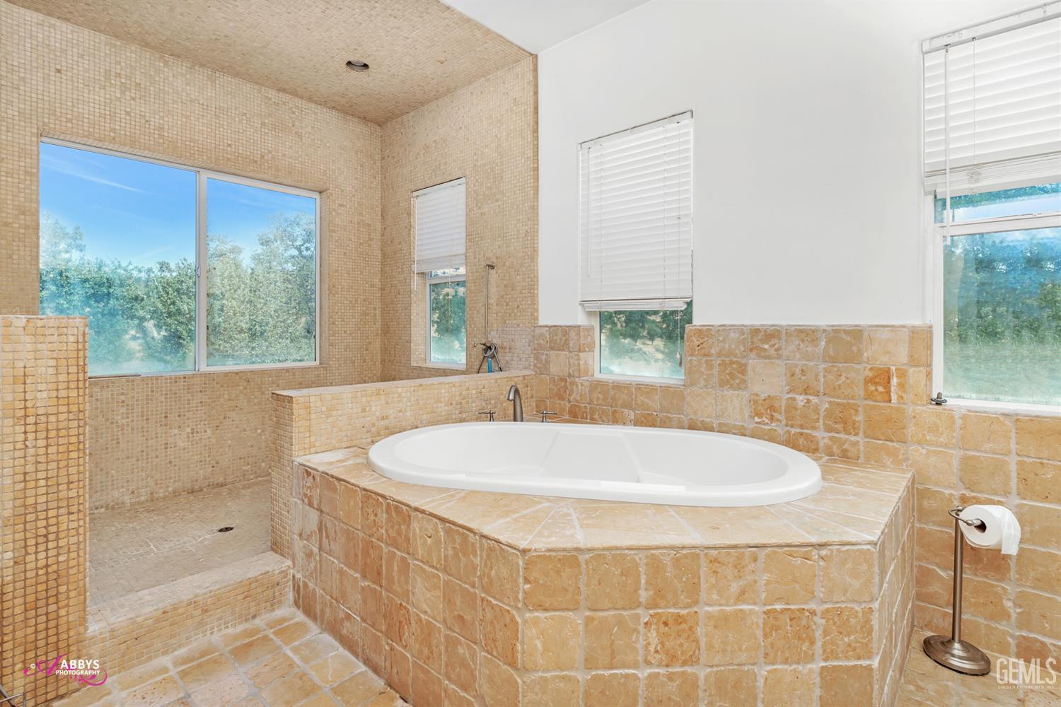 Undisclosed Address Woody, CA 93287 - Photo 12 of 30 a bath tub sitting in a bathroom next to a window