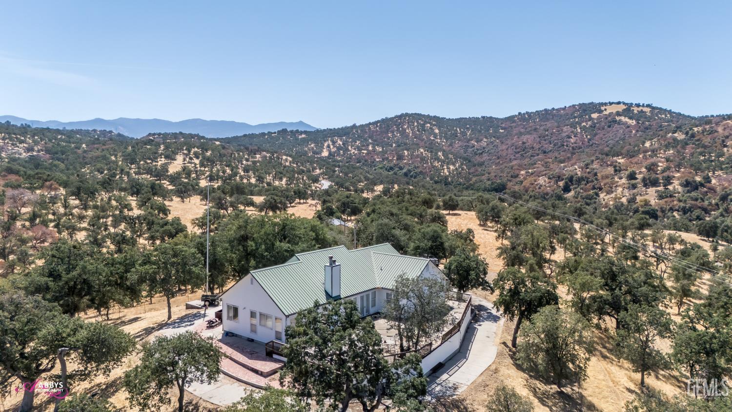Undisclosed Address Woody, CA 93287 - Photo 30 of 30 an aerial view of a house with a mountain in the background