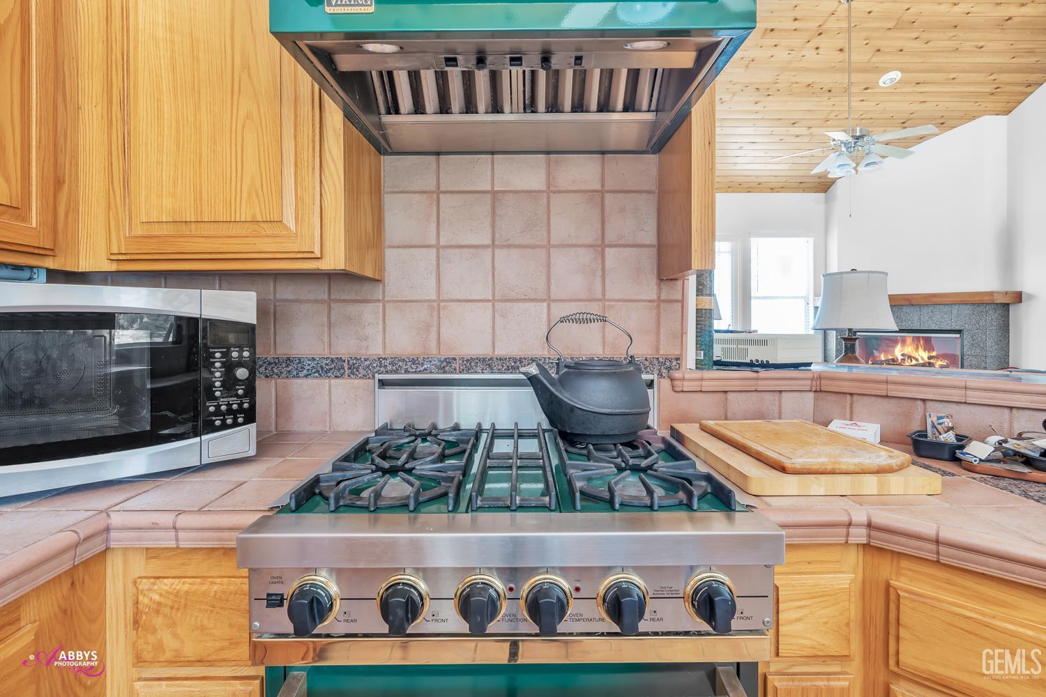 Undisclosed Address Woody, CA 93287 - Photo 10 of 30 a kitchen with stainless steel appliances granite countertop a stove and a microwave