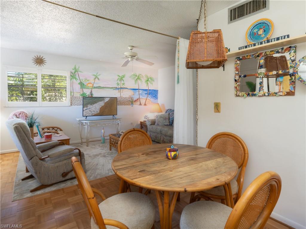 3325 Airport Road North, Unit E8 Naples, FL 34105 - Photo 4 of 7 a dining room with furniture and window