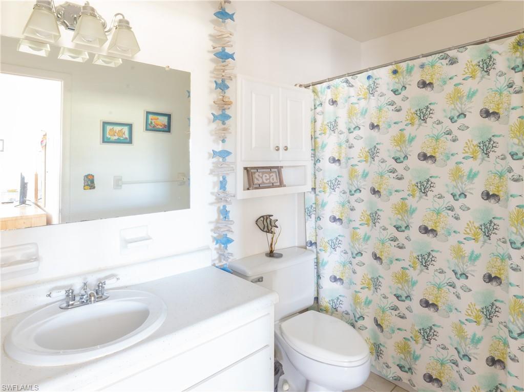 3325 Airport Road North, Unit E8 Naples, FL 34105 - Photo 7 of 7 a bathroom with a sink toilet and shower