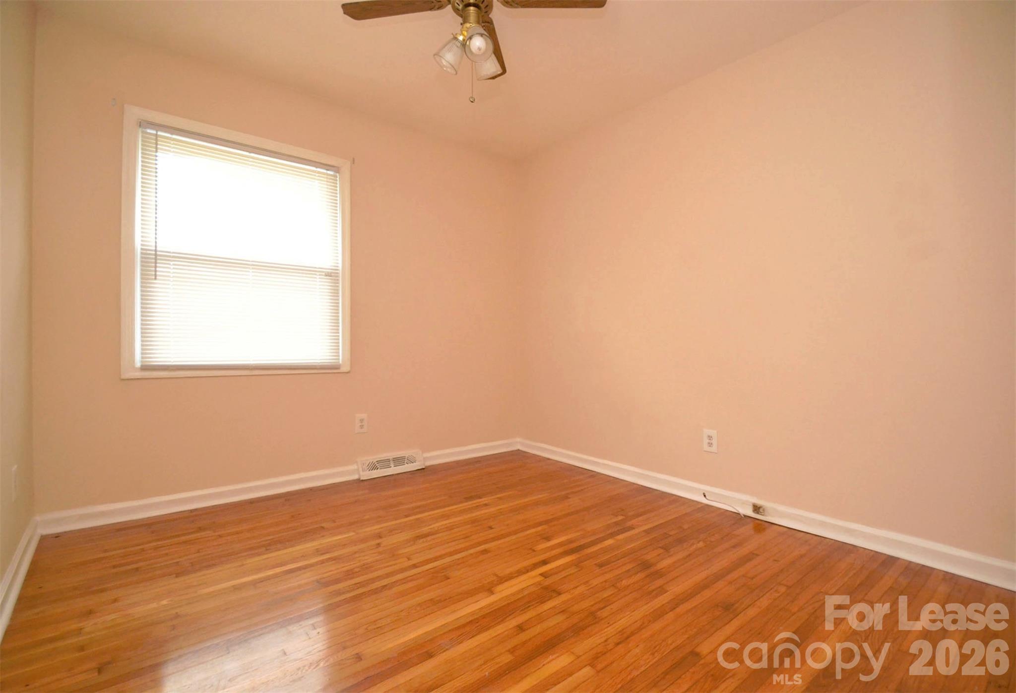 832 Tilden Road Charlotte, NC 28214 - Photo 12 of 13 an empty room with a window