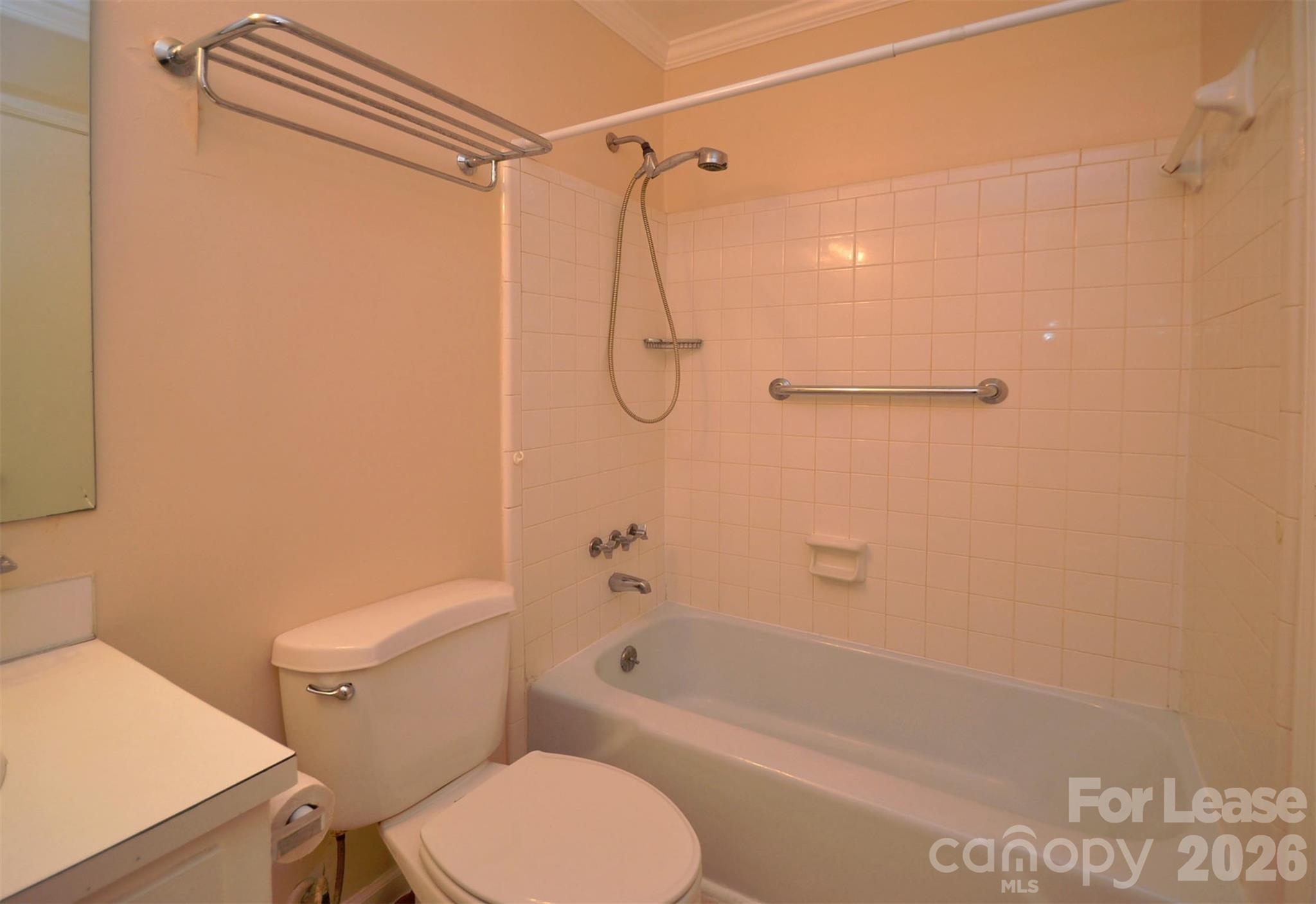 832 Tilden Road Charlotte, NC 28214 - Photo 13 of 13 a bathroom with a shower a toilet and a shower