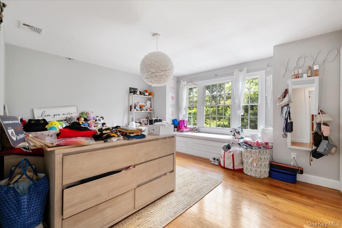 5 Fox Hunt Court Cold Spring Harbor, NY 11724 - Photo 23 of 42 Hardwood flooring complemented by a window seat and ample natural light
