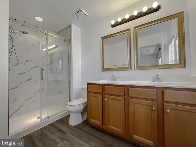 an aerial view of residential houses with outdoor space and swimming pool