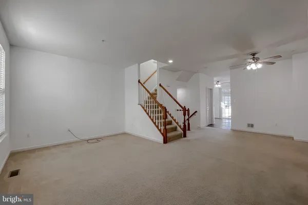 a kitchen with a refrigerator and a sink