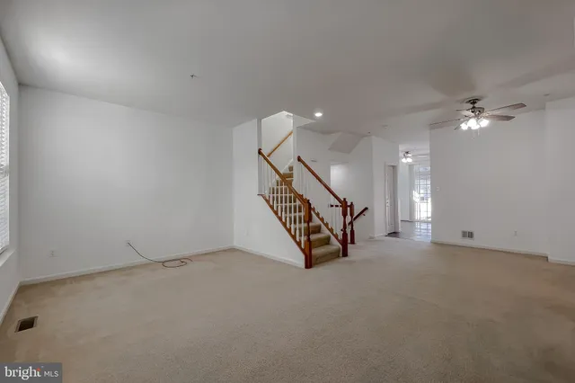 a kitchen with a refrigerator and a sink