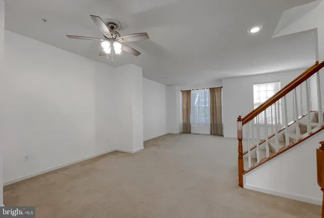 a kitchen with granite countertop wooden cabinets and stainless steel appliances