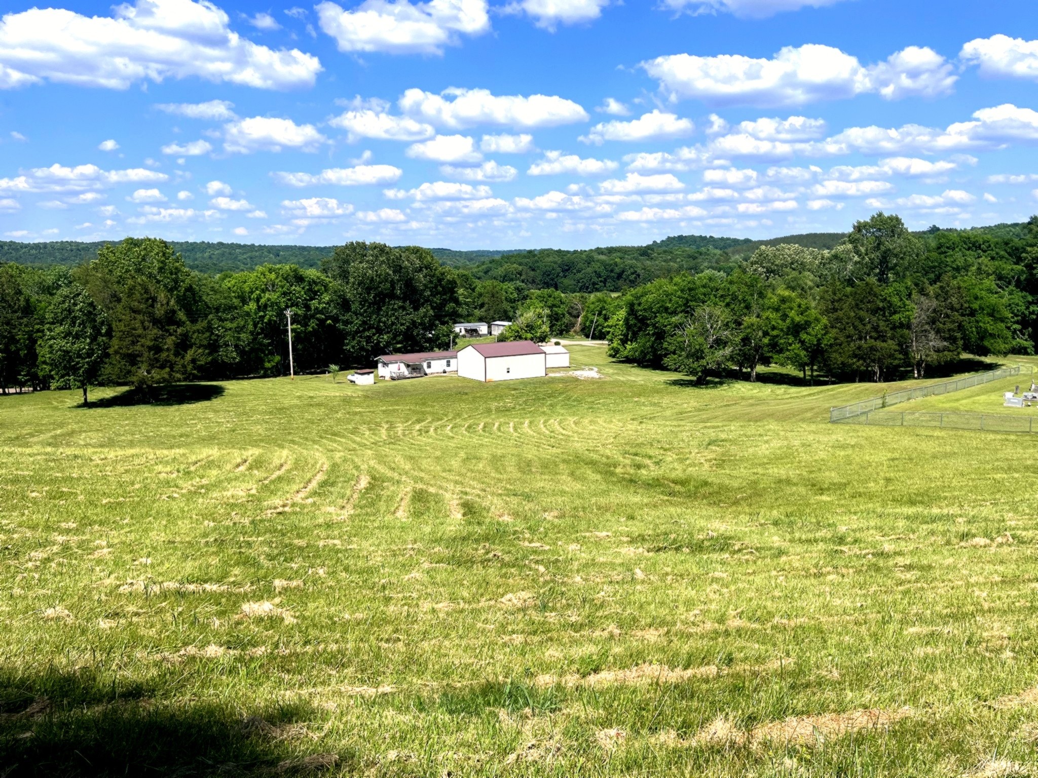 1133 Culps Bend Road Clifton, TN 38425 - Photo 41 of 51 a view of a lake with a houses