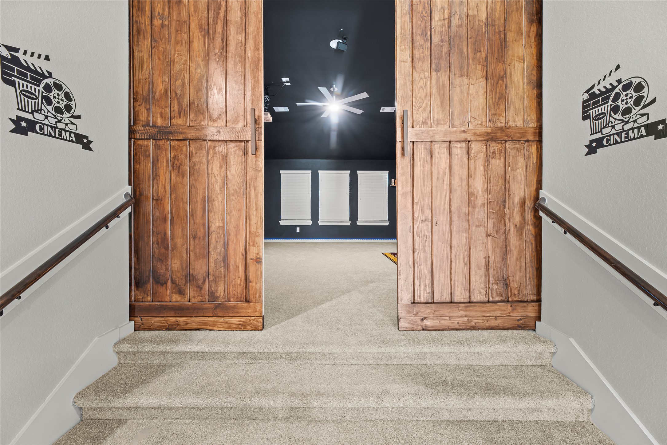 1600 Del Sol Rdg Lane Katy, TX 77493 - Photo 13 of 28 The media room is accented by large wooden double sliding barn doors that serve as a dramatic focal point.