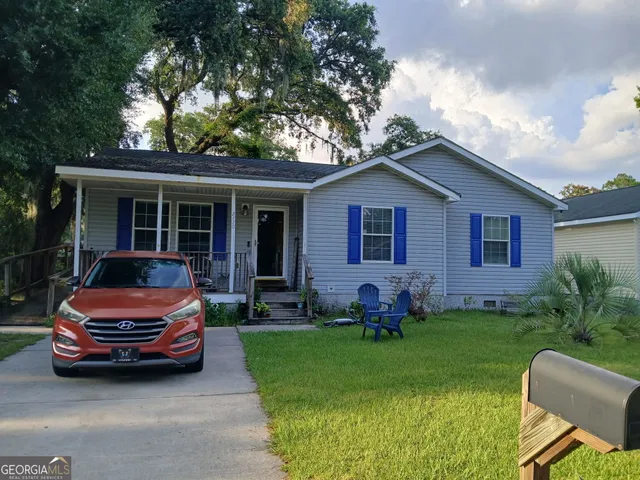 a house with garden in front of it