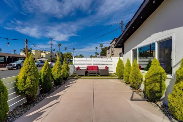 a view of a backyard with sitting area