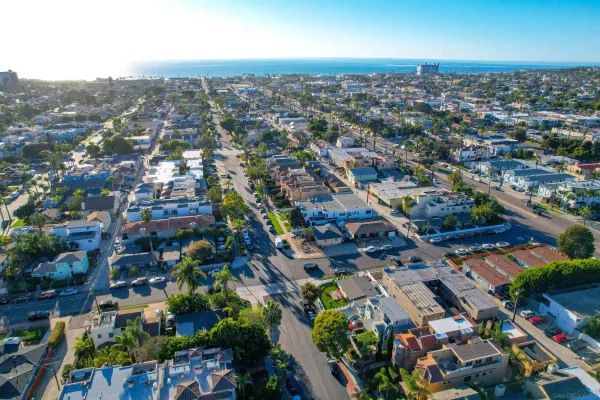 an aerial view of residential houses with outdoor space