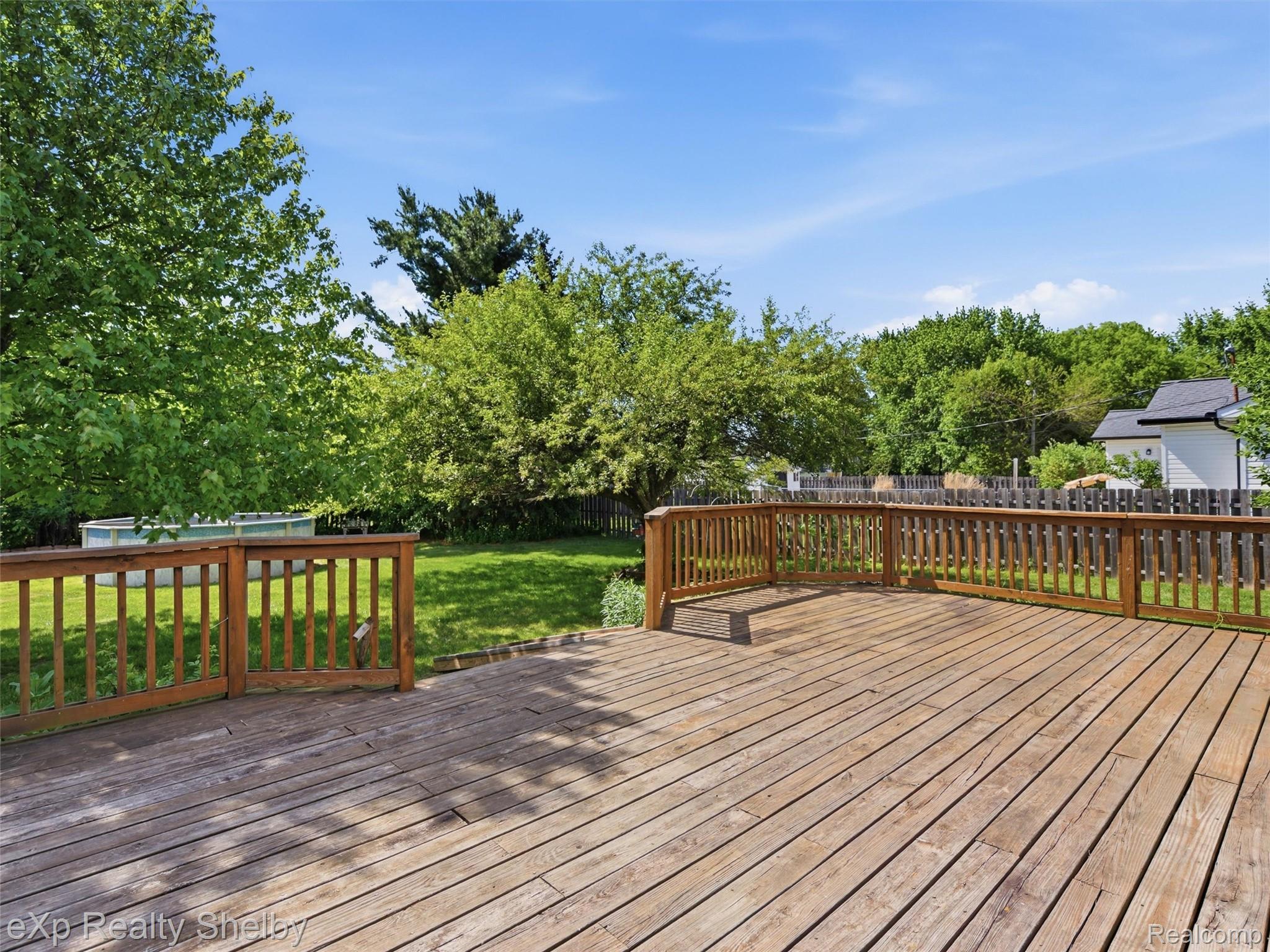 4154 Union Street Dryden, MI 48428 - Photo 39 of 41 Spacious wood deck with a full railing system, offering ample outdoor living space