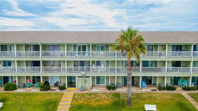 a front view of a building with garden