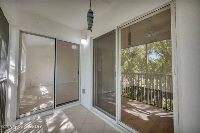 a view of entryway with a glass door and shower
