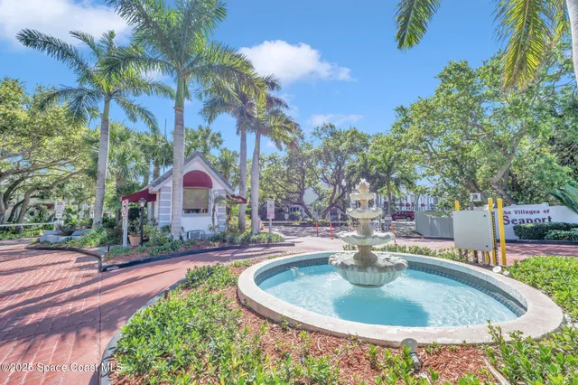 a swimming pool with outdoor seating and yard