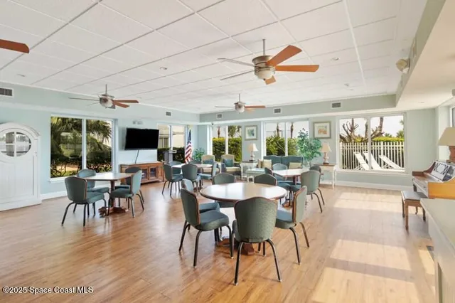 a view of a dining room with furniture window and outside view
