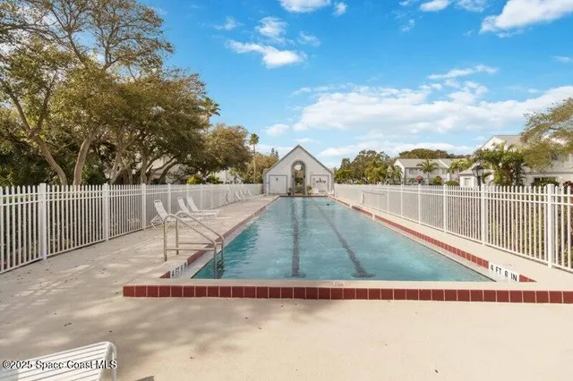 a view of a patio with swimming pool table and chairs