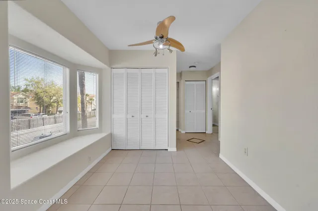 a view of an empty room with a window