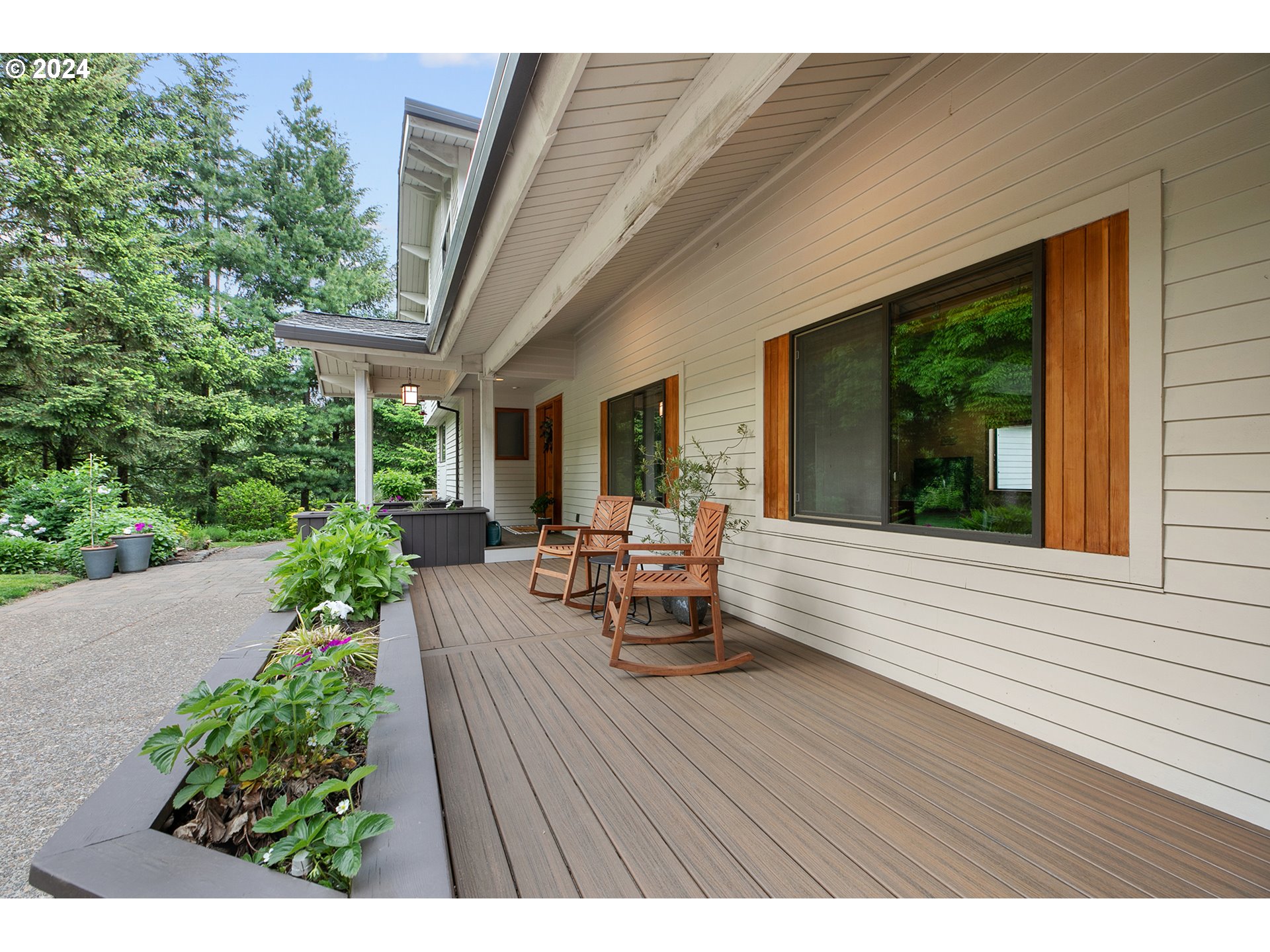 28900 Southwest Heater Road Sherwood, OR 97140 - Photo 4 of 48 a view of a patio with table and chairs potted plants with wooden floor