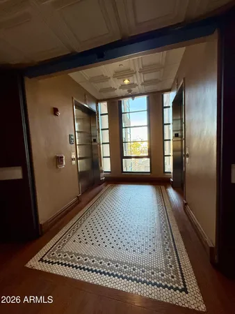 an empty room with wooden floor