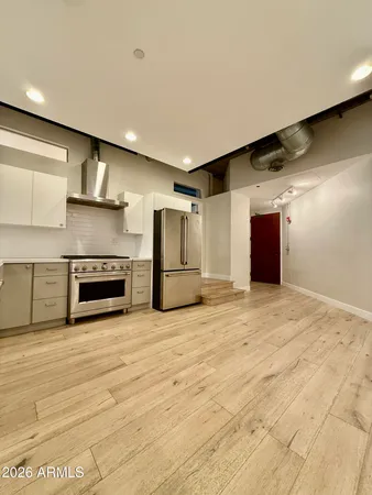 a view of an empty room with a fireplace