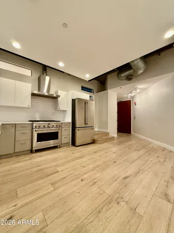 a view of an empty room with a fireplace