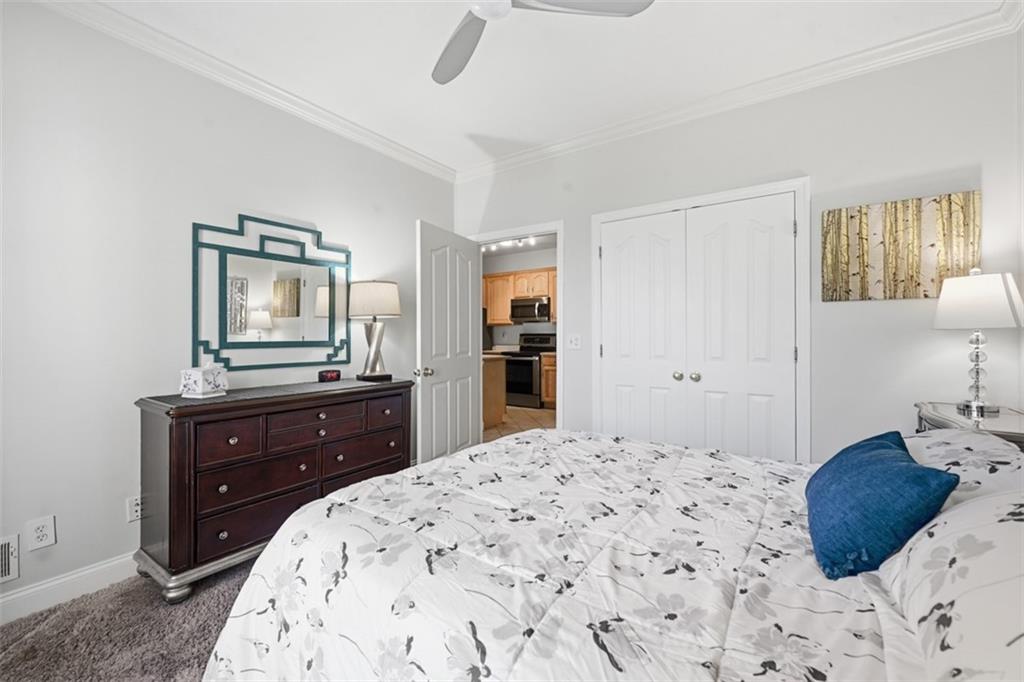 217 Adams Pointe Boulevard, Unit 11 Mars, PA 16046 - Photo 13 of 27 a bedroom with a bed and a dresser