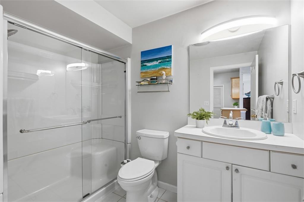 217 Adams Pointe Boulevard, Unit 11 Mars, PA 16046 - Photo 15 of 27 a bathroom with a sink a toilet and shower