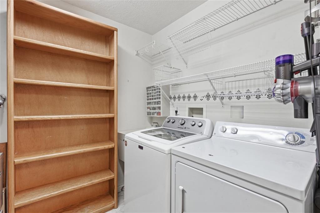 217 Adams Pointe Boulevard, Unit 11 Mars, PA 16046 - Photo 16 of 27 a utility room with dryer and washer