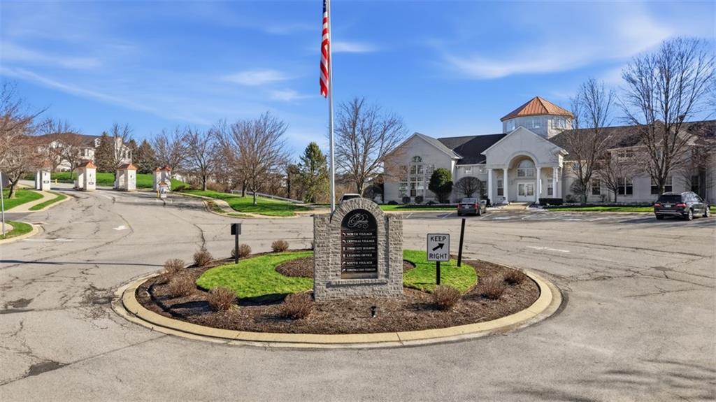 217 Adams Pointe Boulevard, Unit 11 Mars, PA 16046 - Photo 17 of 27 a front view of a house with a yard