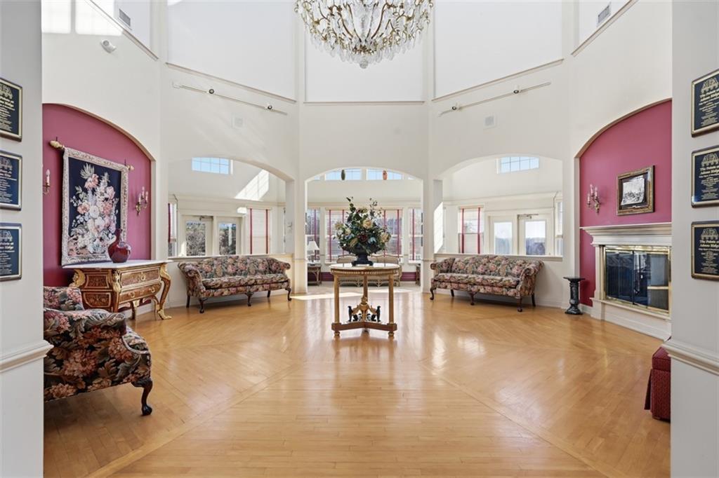 217 Adams Pointe Boulevard, Unit 11 Mars, PA 16046 - Photo 18 of 27 a living room with furniture and a fireplace