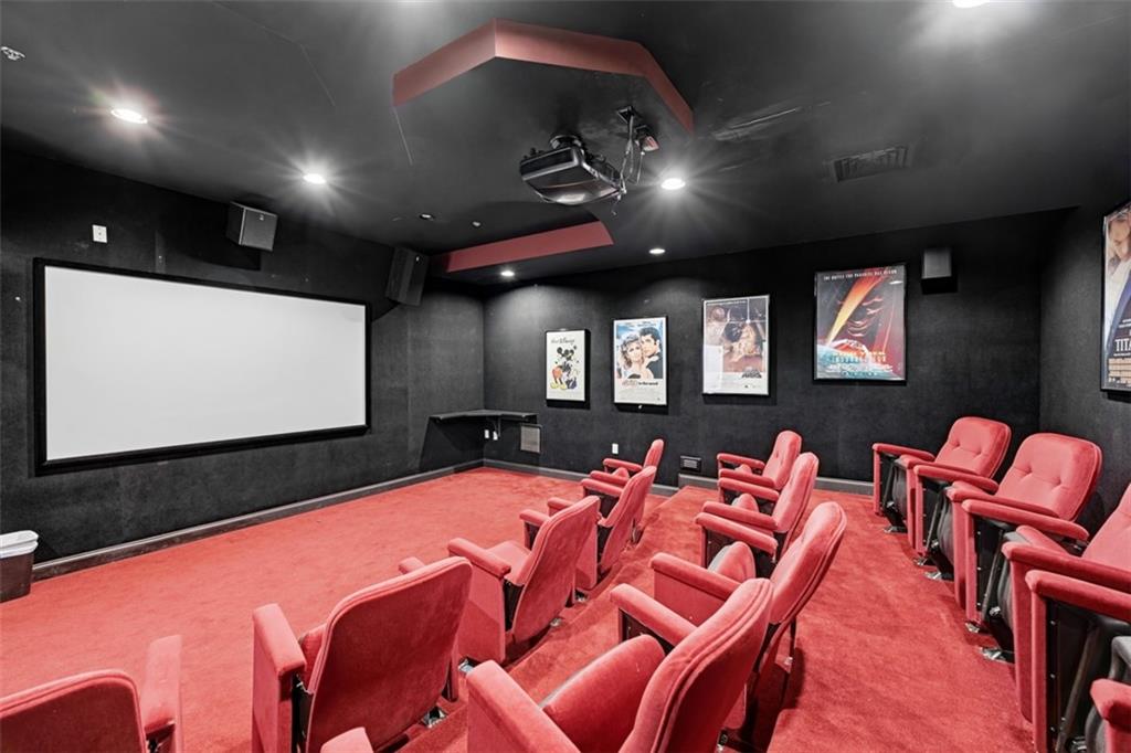 217 Adams Pointe Boulevard, Unit 11 Mars, PA 16046 - Photo 20 of 27 a projector room with pool chairs