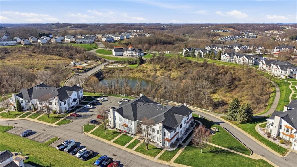 217 Adams Pointe Boulevard, Unit 11 Mars, PA 16046 - Photo 25 of 27 an aerial view of residential houses with outdoor space
