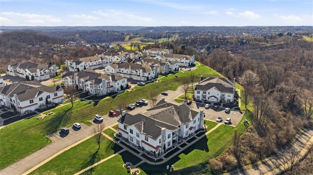 217 Adams Pointe Boulevard, Unit 11 Mars, PA 16046 - Photo 26 of 27 an aerial view of a house with a swimming pool outdoor seating and yard