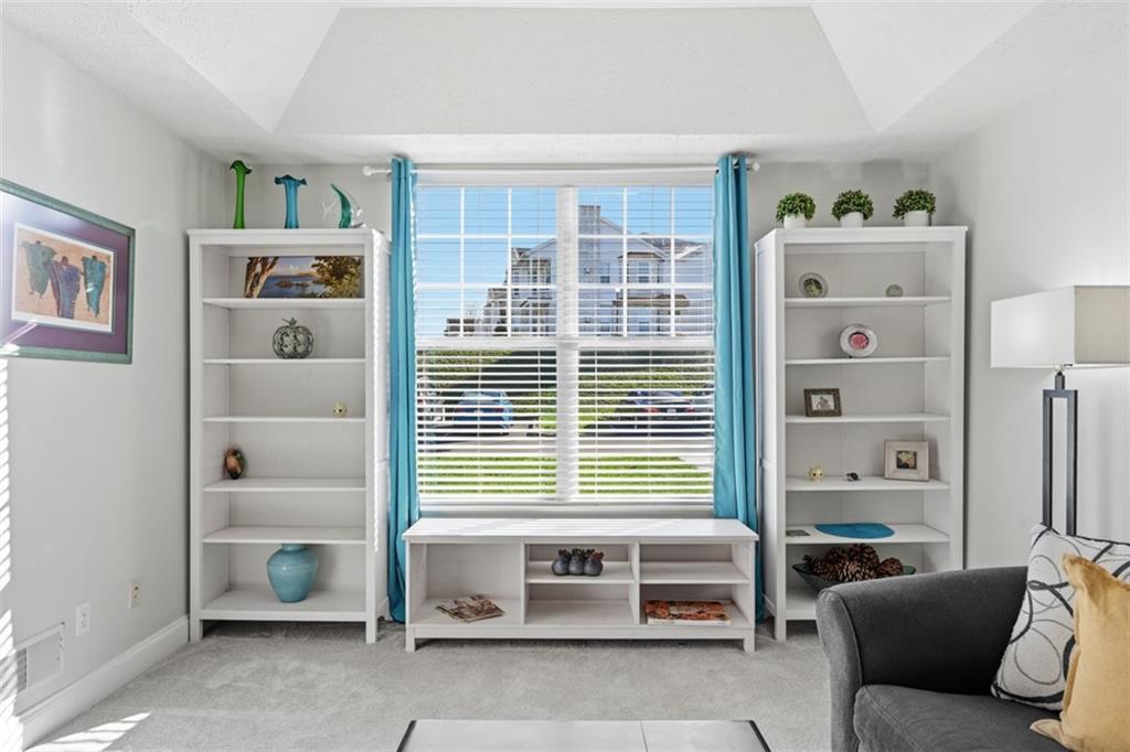 217 Adams Pointe Boulevard, Unit 11 Mars, PA 16046 - Photo 6 of 27 a living room with furniture and a window