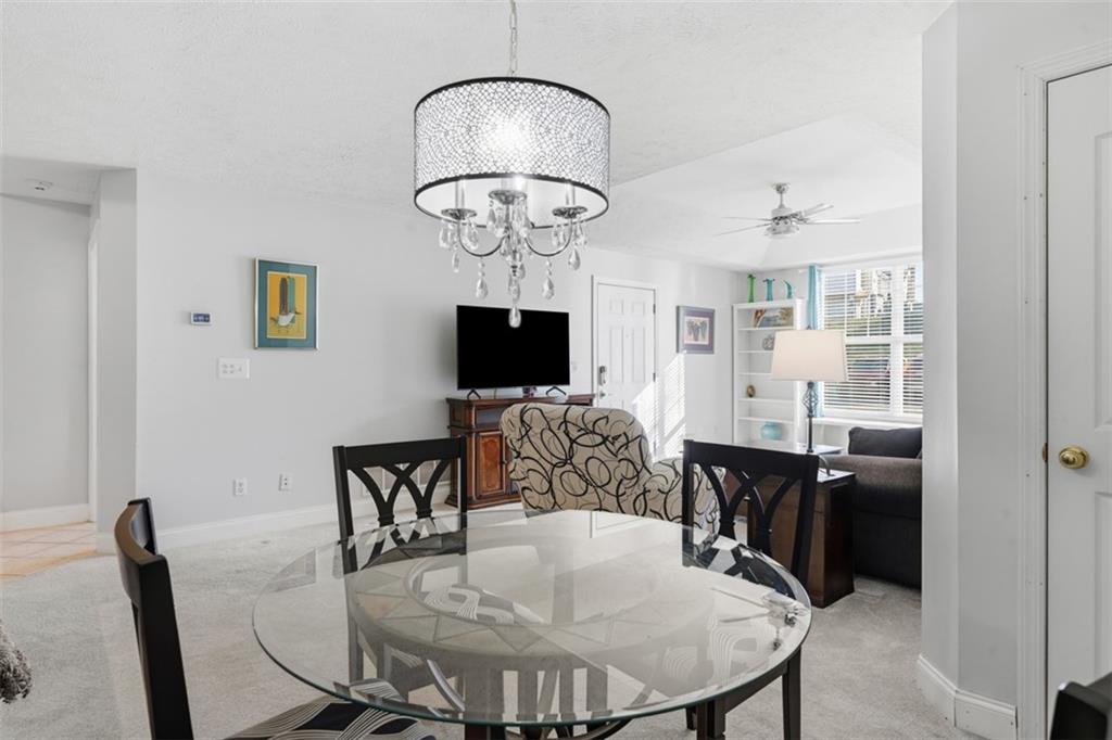 217 Adams Pointe Boulevard, Unit 11 Mars, PA 16046 - Photo 8 of 27 a view of a dining room with furniture